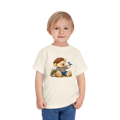 Blue Bird Pickles toddler tee in Natural, worn by a toddler