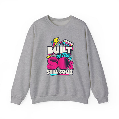 Built in the 80s. Still Solid Crewneck Sweatshirt in Sport Grey, front view with neon cassette design