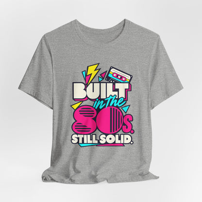 Built in the 80s. Still Solid Tee in Athletic Heather, styled photo