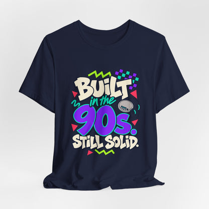 Built in the 90s. Still Solid Tee in Navy, styled photo