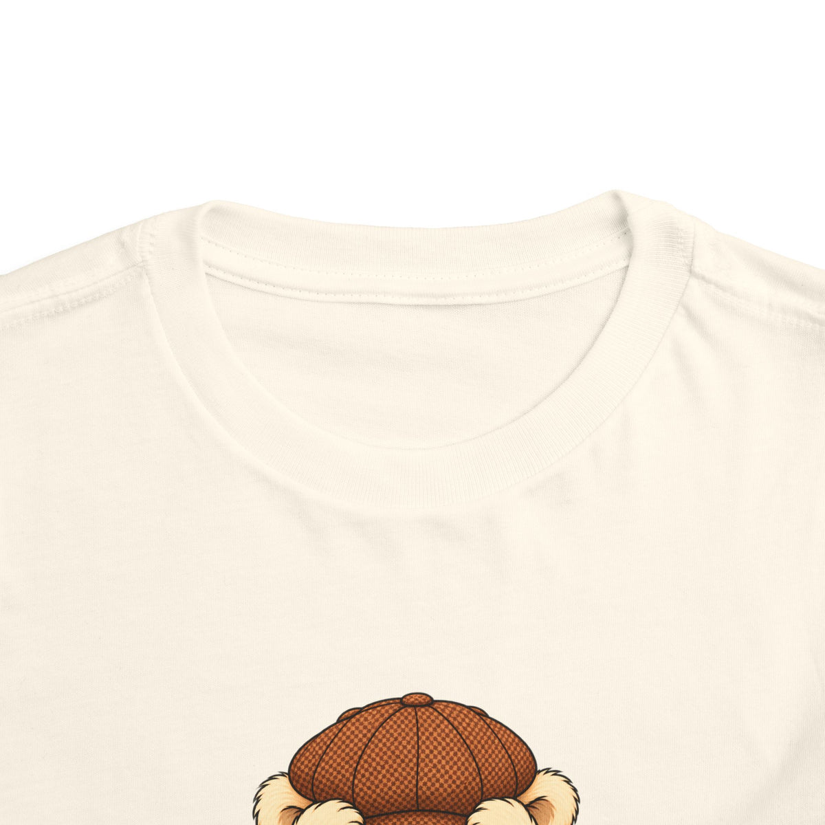 Peek-a-Boo Pickles toddler tee in Natural, close-up of neckline and print