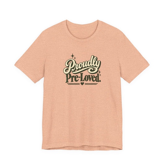 Proudly Pre-Loved funny tee in Heather Peach, front view