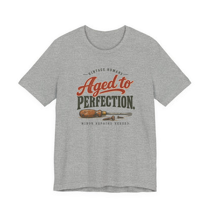 Vintage Humans Aged To Perfection funny tee in Athletic Heather, front view