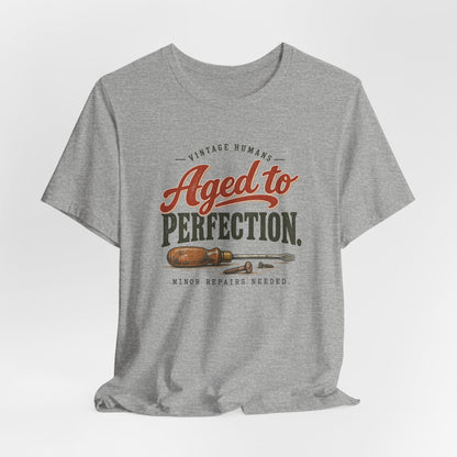 Vintage Humans Aged To Perfection funny tee in Athletic Heather, lifestyle shot