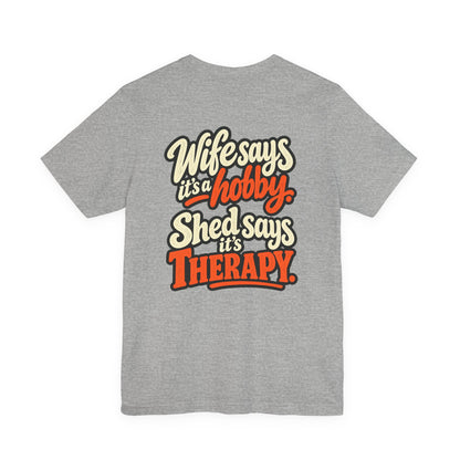 Wife Says It's a Hobby, Shed Says It's Therapy funny tee in Athletic Heather, front view